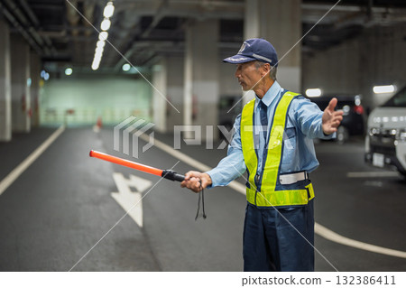 Security guard, traffic control officer, senior man 132386411
