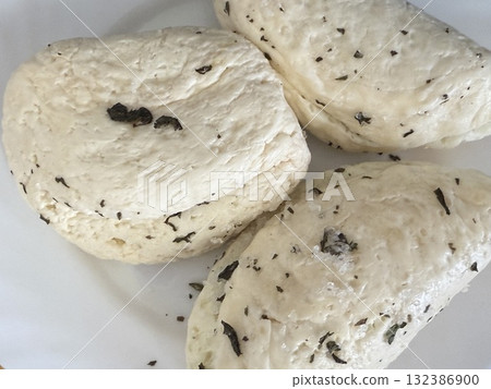 Traditional Cypriot homemade halloumi cheese. Mediterranean cuisine, delicious home cooking. 132386900