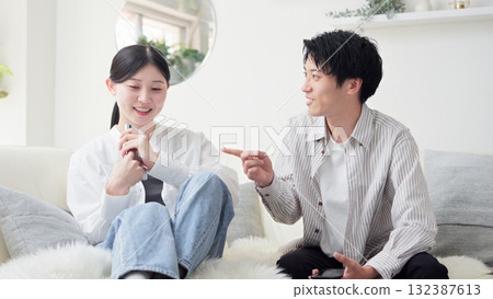 Asian couple arguing over smartphone 132387613