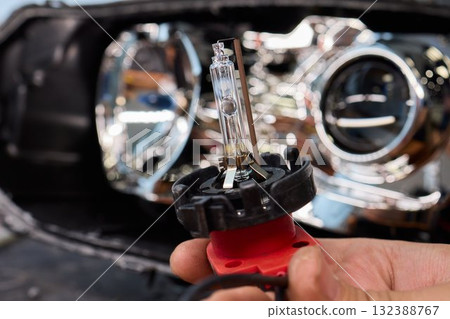 This is a Close Up View of the Car Headlight Bulb Replacement Process for better clarity This is a Close Up View of the Car Headlight Bulb Replacement Process for better clarity 132388767