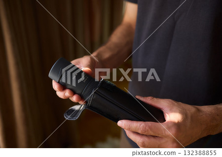 A Person Diligently Using a Telescope for Detailed Observation of the Night Sky and Beyond A Person Diligently Using a Telescope for Detailed Observation of the Night Sky and Beyond 132388855