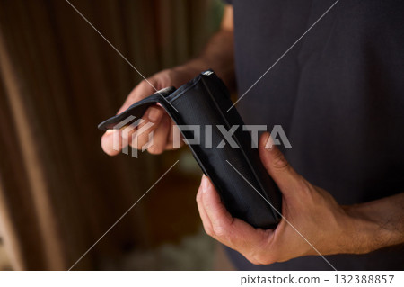 A Person Diligently Using a Telescope for Detailed Observation of the Night Sky and Beyond 132388857