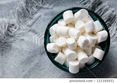 White Marshmallow Candies in Bowl on Gray Fabric Top View Copy Space White Marshmallow Candies in Bowl on Gray Fabric Top View Copy Space 132388931