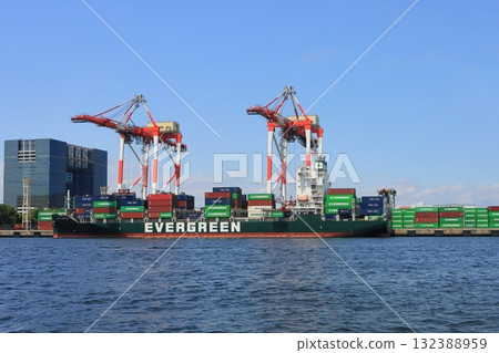 Port facilities in the bay area: cargo ships loading containers 132388959