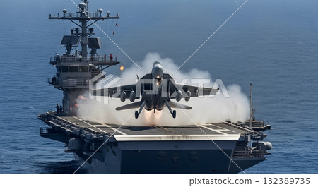 Military Jet Taking Off From Aircraft Carrier Amidst White Smoke at Sea 132389735