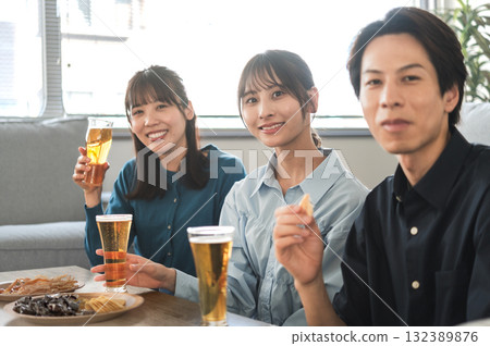 Three men and women having a drinking party 132389876