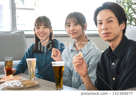 Three men and women having a drinking party Three men and women having a drinking party 132389877