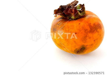 Imperfect persimmon on white background Imperfect persimmon on white background 132390571
