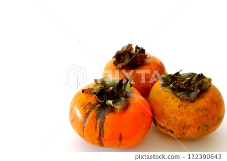 Imperfect persimmon on white background 132390643