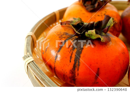 Imperfect persimmon on white background Imperfect persimmon on white background 132390648