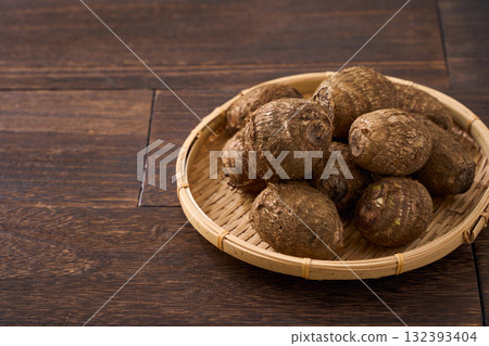 Japanese-style cut taro (with mud) served in a bamboo basket Japanese-style cut taro (with mud) served in a bamboo basket 132393404