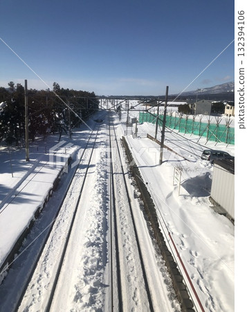 An express train running through the snow on a winter morning An express train running through the snow on a winter morning 132394106