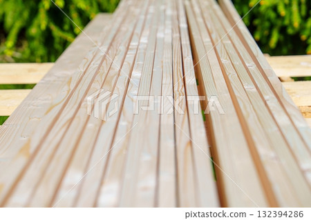 Stack of New Lumber Boards for Construction, Carpentry, or DIY Projects on Pallet 132394286