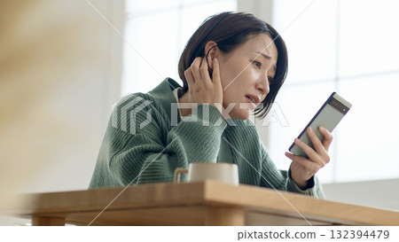 The woman (miss) operating her cell phone, oh no! 132394479