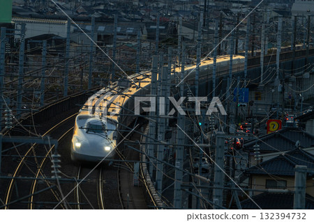 Nozomi Shinkansen bound for Tokyo Station. Winter sunset view from Shishikan Amusement Park. 14. Higashi Ward, Okayama City, Okayama Prefecture. 132394732