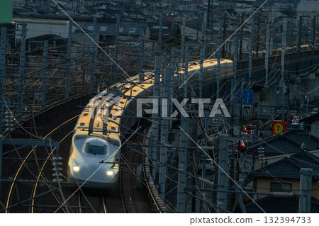 Nozomi Shinkansen bound for Tokyo Station. Winter sunset view from Shishikan Amusement Park. 13. Higashi Ward, Okayama City, Okayama Prefecture. Nozomi Shinkansen bound for Tokyo Station. Winter sunset view from Shishikan Amusement Park. 13. Higashi Ward, Okayama City, Okayama Prefecture. 132394733