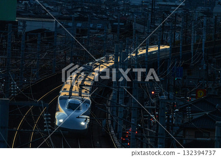 Nozomi Shinkansen bound for Tokyo Station. Winter sunset view from Shishikan Amusement Park. Higashi Ward, Okayama City, Okayama Prefecture. 132394737