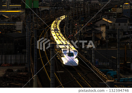 Nozomi Shinkansen bound for Tokyo Station. Winter sunset view from Shishikan Amusement Park 4. Higashi Ward, Okayama City, Okayama Prefecture. Nozomi Shinkansen bound for Tokyo Station. Winter sunset view from Shishikan Amusement Park 4. Higashi Ward, Okayama City, Okayama Prefecture. 132394746
