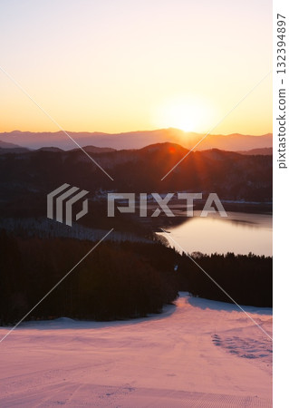 Hakuba Sanosaka Ski Resort: Lake Aoki and the slopes bathed in the morning glow during sunrise hours Hakuba Sanosaka Ski Resort: Lake Aoki and the slopes bathed in the morning glow during sunrise hours 132394897