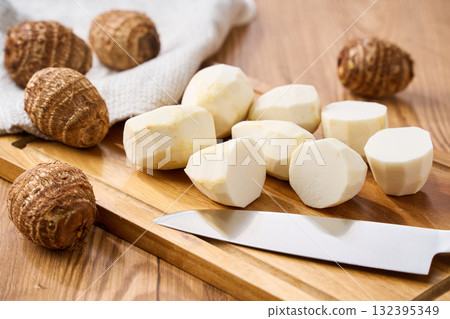 Taro prepared on a cutting board | Cutting cooking process Taro prepared on a cutting board | Cutting cooking process 132395349