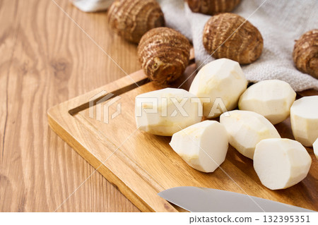 Taro prepared on a cutting board | Cutting cooking process Taro prepared on a cutting board | Cutting cooking process 132395351