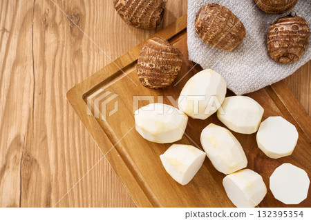 Taro prepared on a cutting board | Cutting cooking process Taro prepared on a cutting board | Cutting cooking process 132395354