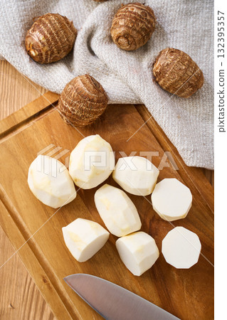 Taro prepared on a cutting board | Cutting cooking process Taro prepared on a cutting board | Cutting cooking process 132395357