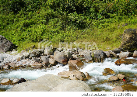 Rushing Mountain Stream and Rocky Riverbank 132396092