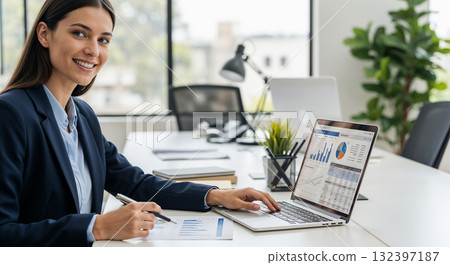 Smiling female accountant in office 132397187