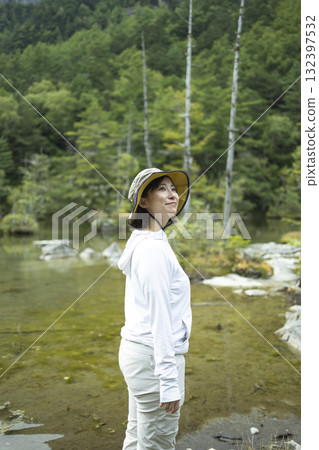 Woman sightseeing in nature Woman sightseeing in nature 132397532