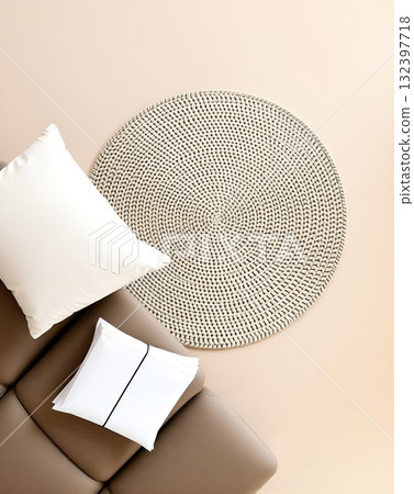 Beige Couch with Elegant Table Decor: Pillow, Documents, and Woven Circle Beige Couch with Elegant Table Decor: Pillow, Documents, and Woven Circle 132397718