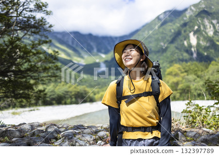 Cute woman hiking 132397789