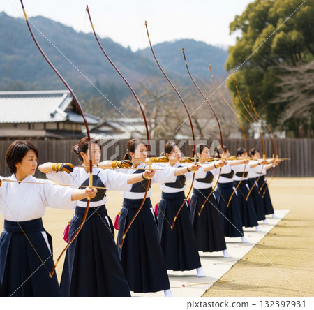A woman practicing Kyudo 132397931