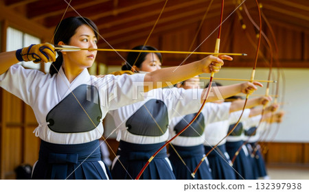 A woman practicing Kyudo 132397938