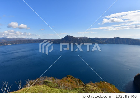 Kamuishu Island and Mount Mashu on Lake Mashu Kamuishu Island and Mount Mashu on Lake Mashu 132398406