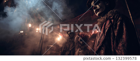 Sinister clown eerie circus foggy night dramatic lighting creepy atmosphere vintage costume haunting expression mysterious horror performance 132399578