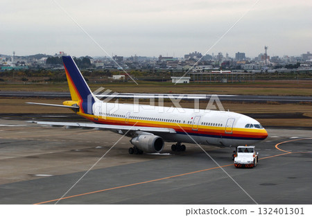 Plane being pushed back for departure 132401301