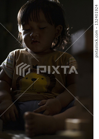 Toddler Playing With Wooden Toys, joyful playtime scene perfect for parenting ads, educational campaigns, and family lifestyle or toy product visuals. 132401924