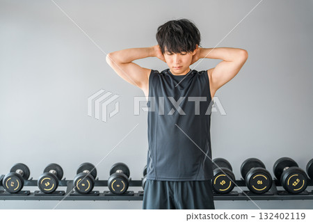 Young Asian man training at the gym Young Asian man training at the gym 132402119