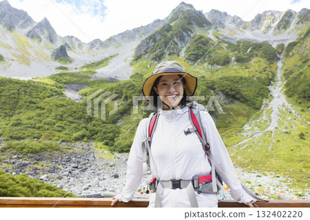 A woman enjoying climbing 132402220
