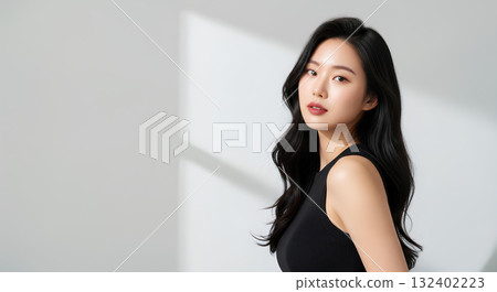 Portrait of a young woman with a cool and sophisticated look 132402223