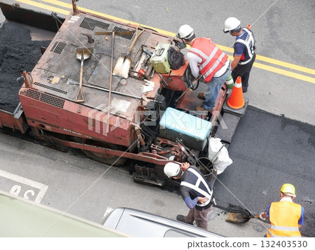 Asphalt road paving during the day 24 132403530