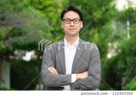 Smiling businessman with arms crossed Smiling businessman with arms crossed 132403568
