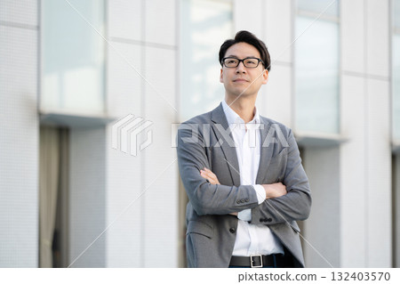 Smiling businessman with arms crossed Smiling businessman with arms crossed 132403570