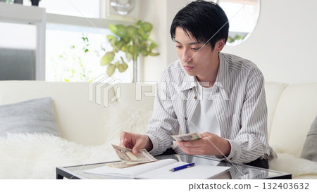 Asian man counting money 132403632