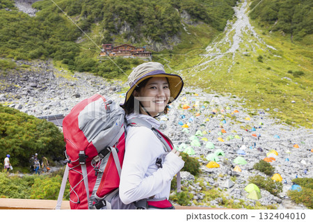 A woman climbing the Northern Alps 132404010