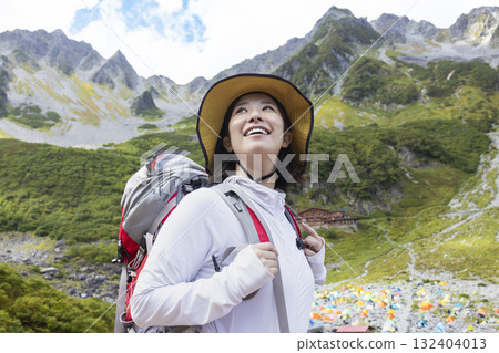 A woman climbing the Northern Alps 132404013