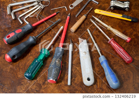 Set of different kind of hand tools on brown wooden table Set of different kind of hand tools on brown wooden table 132406219