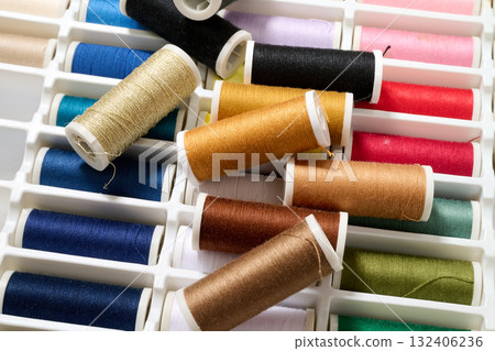 spools of multicolored sewing thread spools of multicolored sewing thread 132406236