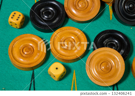 Black and yellow backgamon pieces and dice 132406241